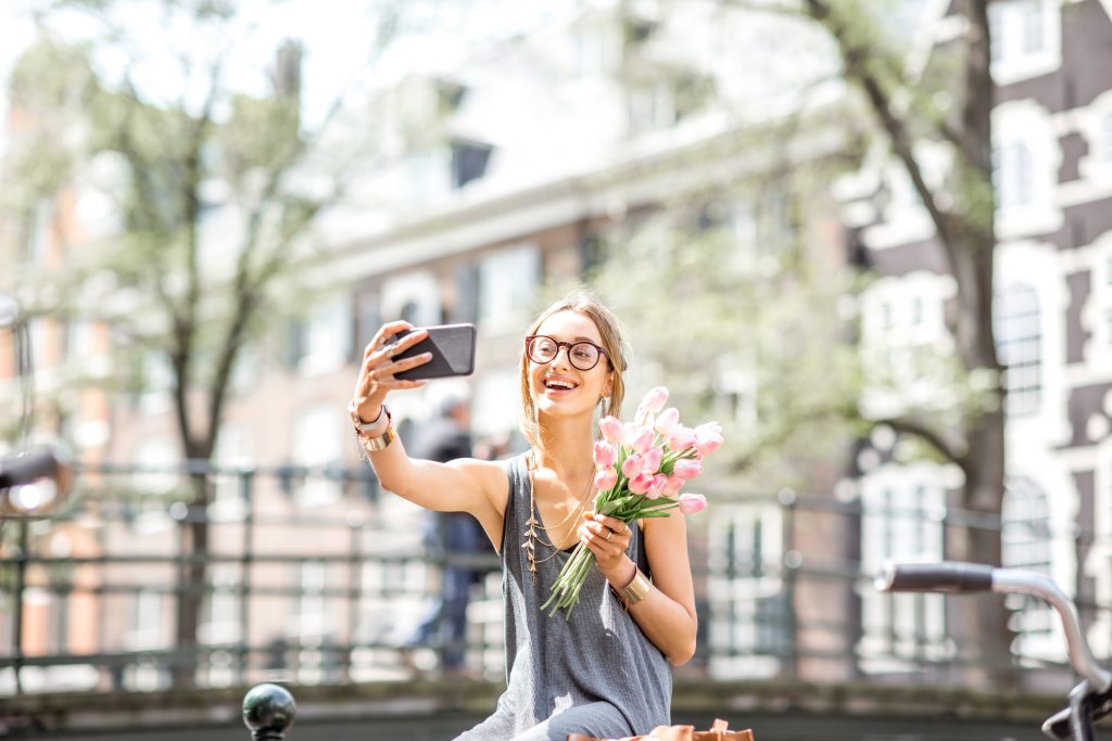 Woman with flowers in Amsterdam city