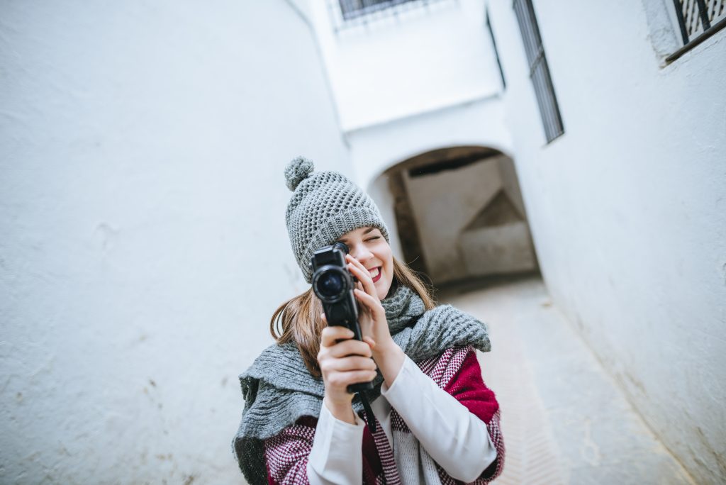 Young woman in Sevilla using video camera